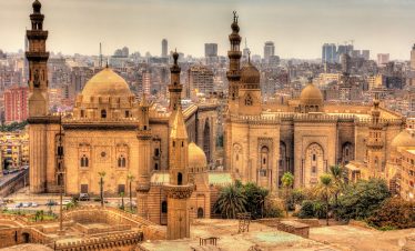 Experience the rich heritage and bustling streets of Cairo, Egypt with Lionsgate Travel, featuring landmarks like the Egyptian Museum and vibrant bazaars.