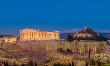 Panoramic view of the Acropolis in Athens, Greece, featuring the Parthenon, under a clear sky, perfect for exploring ancient Greek history and architecture.
