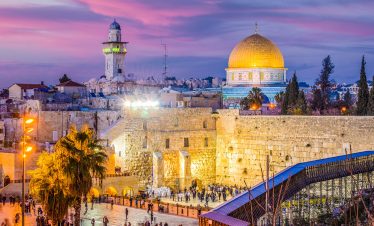 Join a Lionsgate Travel pilgrimage to the Western Wall in Jerusalem, where visitors from around the world come to pray against the ancient stones.